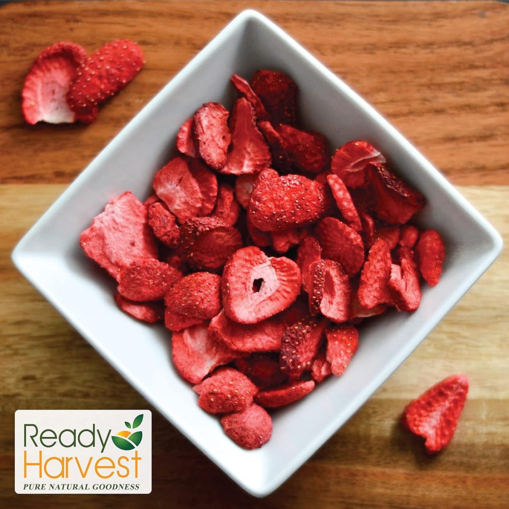 bowl of freeze-dried strawberry slices showing crispy texture